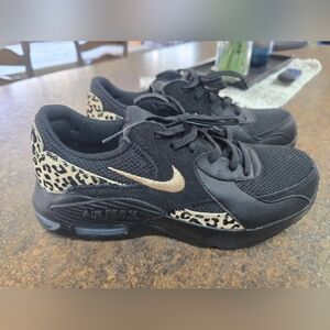 Nike Black Sneakers with Gold Swoosh and Leopard Trim